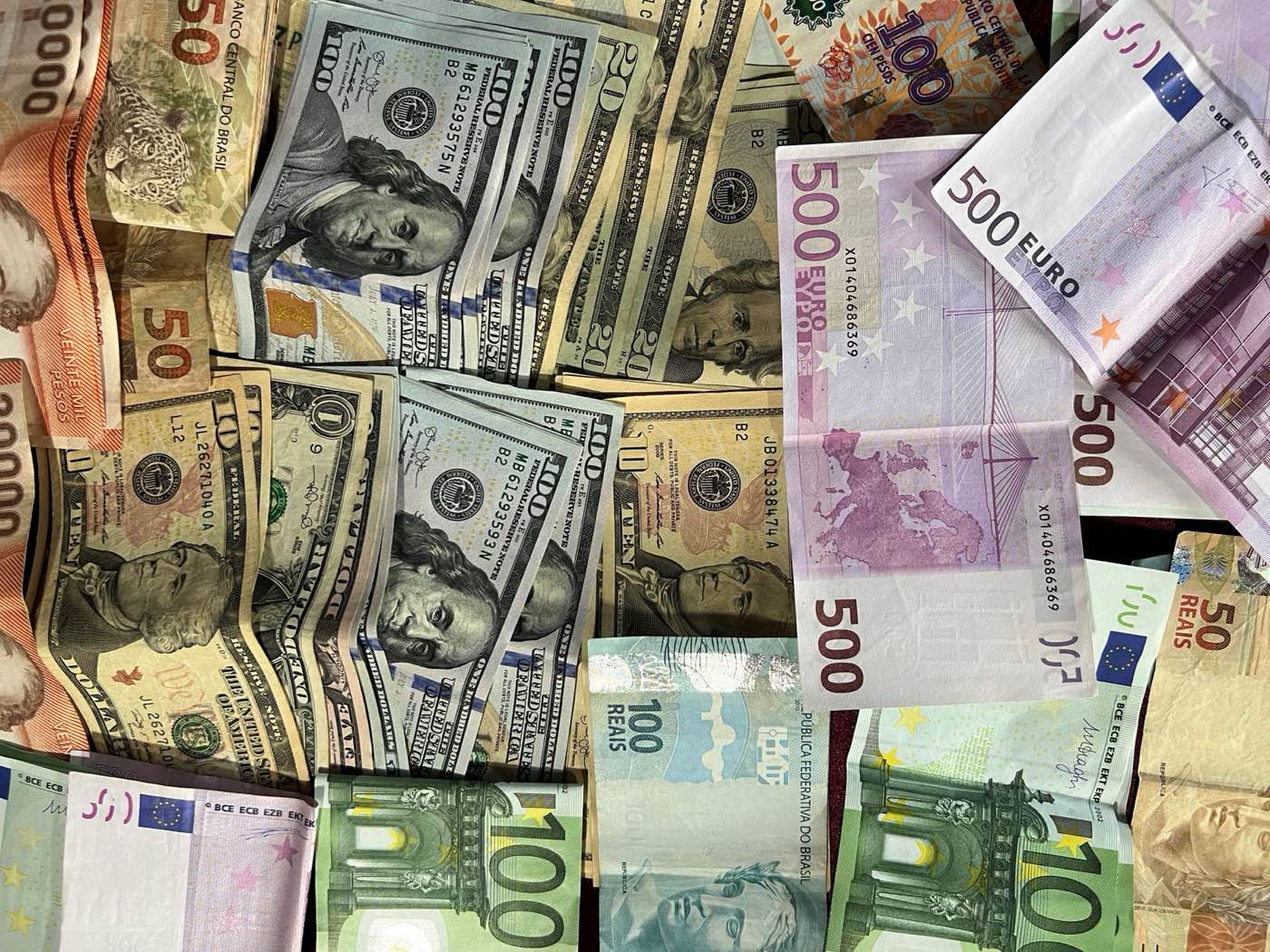 Banknotes from multiple national currencies representing local-currency clearing arrangements
