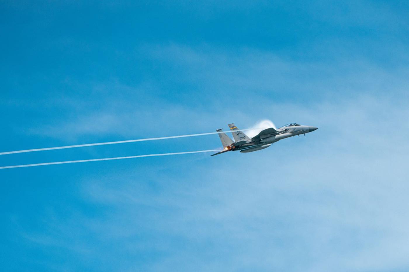 Military fighter aircraft in flight representing defence offset obligations
